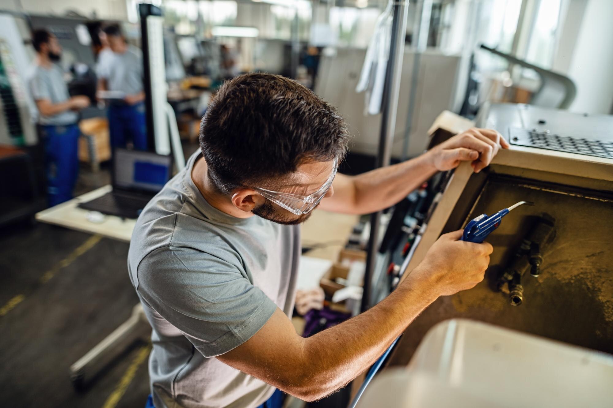 young manual worker working industrial machine factory plant 637285 4186